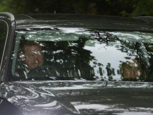 Prince Harry in an Audi drives his girlfriend, the American actor Meghan Markle, to the wedding reception. Picture: News Group Newspapers Ltd.