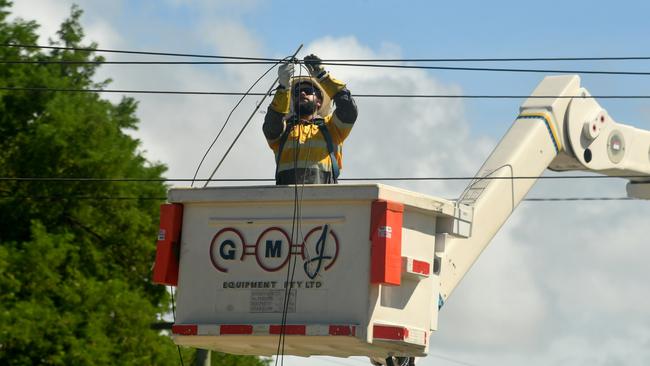 Cyclone Kirrily Townsville 2024. Ergon Engery workers restore power in Flower Street, Railway Estate. Picture: Evan Morgan