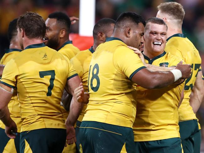 Taniela Tupou (C) and Tom Robertson (R) celebrate victory. Pic: Getty