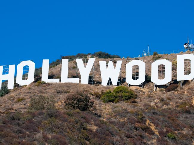 Los Angeles, United States - December 5, 2006:  Low Angle view of the Hollywood Sign in Los Angeles, California.  The Hollywood Sign has sit atop Mount Lee for about 88 years (however, it was rebuilt in 1978 with steel) in Los Angeles, and is a world icon, landmark, and symbol of the Film Industry.  It\\'s letters are about 45 feet high and the whole sign is about 350 feet long.