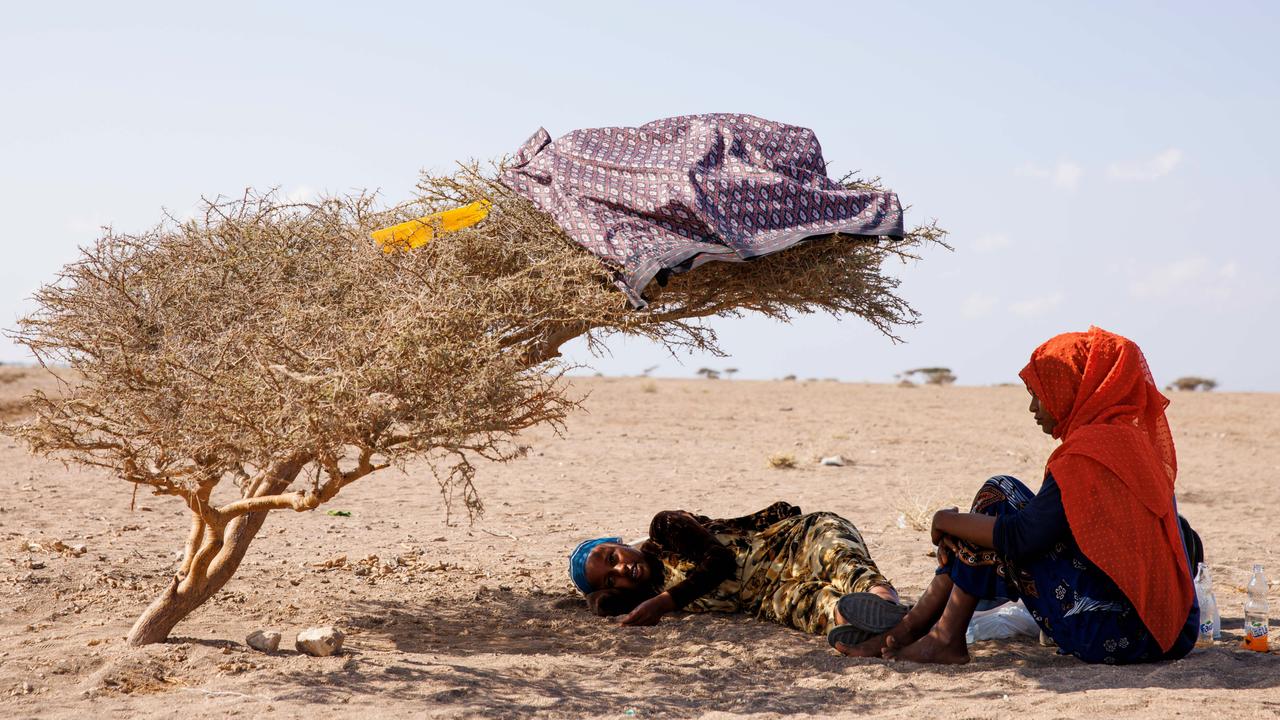 Migrants rest under a shrub in Djibouti. US air strikes on Yemen’s Houthis have disrupted the Ethiopian migrant route, as well as key shipping lanes. Picture: Luke Dray/Getty Images