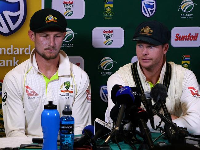 Steve Smith (right) and Cameron Bancroft face the media and admit their plan to tamper with the ball. Picture: AFP