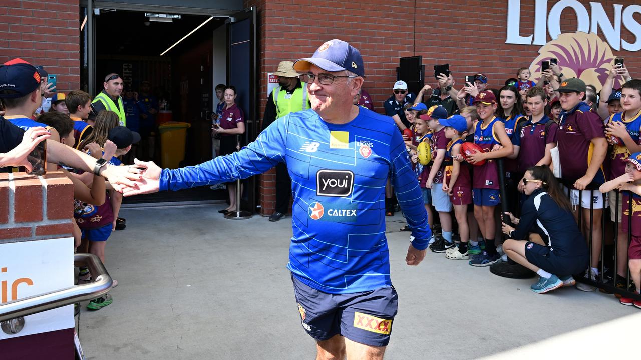 IPSWICH, AUSTRALIA - SEPTEMBER 24: Chris Fagan, Senior Coach, greets fans during a Brisbane Lions AFL training session at Brighton Homes Arena on September 24, 2024 in Ipswich, Australia. (Photo by Bradley Kanaris/Getty Images)