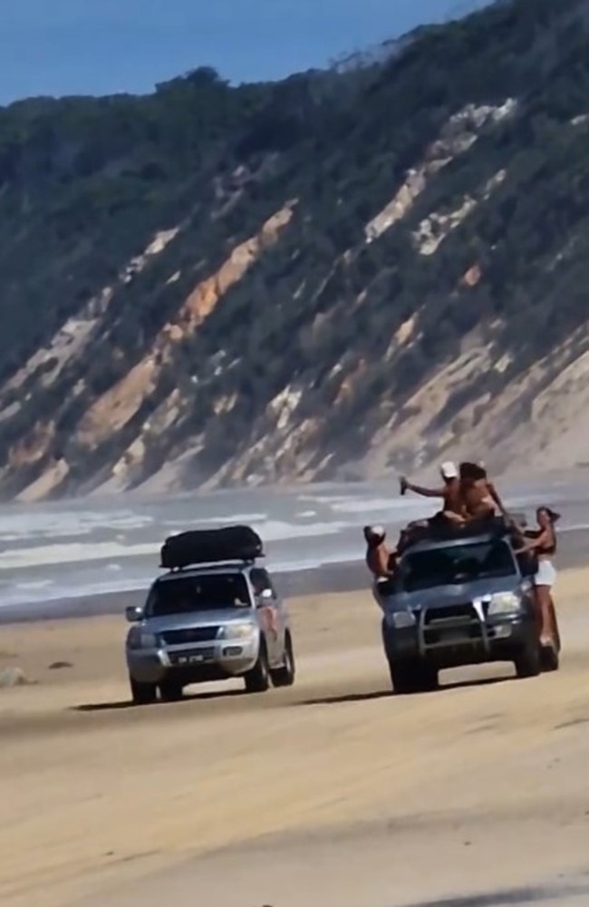 A group of people were filmed hanging onto the outside of a 4WD that was travelling on Rainbow Beach. Picture: Derrin Cook