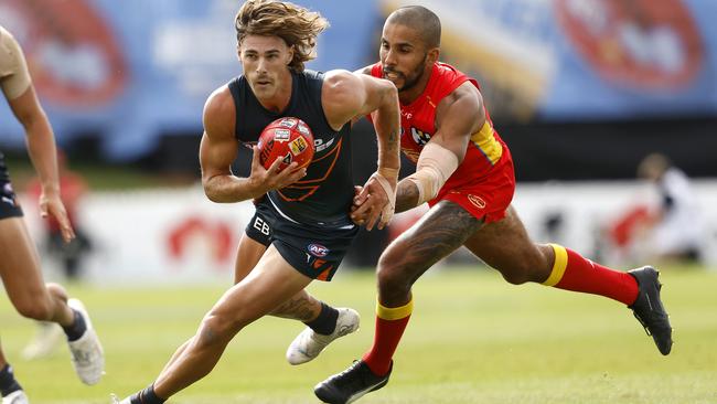 Giants James Peatling and Suns' Touk Miller during the AFL Gather Round match between the GWS Giants and Gold Coast Suns at Mount Barker, Adelaide on April 7, 2024.  Photo by Phil Hillyard(Image Supplied for Editorial Use only - **NO ON SALES** - Â©Phil Hillyard )