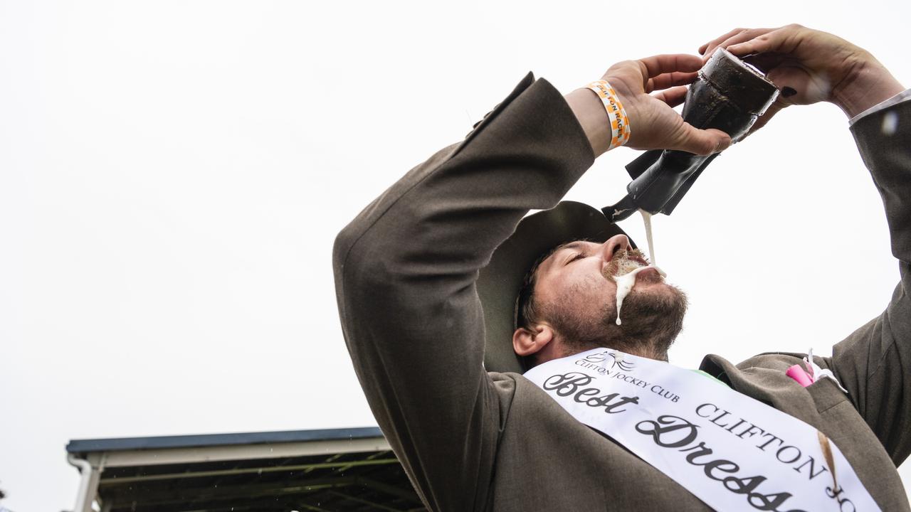 Winner of Best Dressed Male Sam Glasheen celebrated his win with a shoey at the Clifton Cup races hosted by Clifton Jockey Club, Saturday, October 22, 2022. Picture: Kevin Farmer