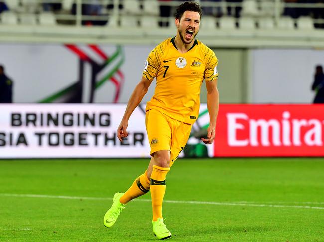 Australia's forward Mathew Leckie celebrates scoring a penalty during the 2019 AFC Asian Cup Round of 16 football match between Australia and Uzbekistan at the Khalifa bin Zayed Stadium in Al-Ain on January 21, 2019. (Photo by Giuseppe CACACE / AFP)