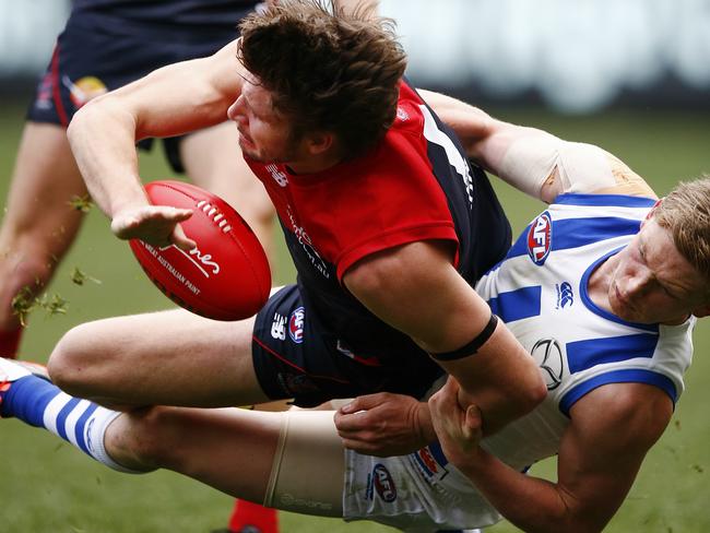 Jack Ziebell brings down Jesse Hogan in a perfect tackle. Picture: Wayne Ludbey