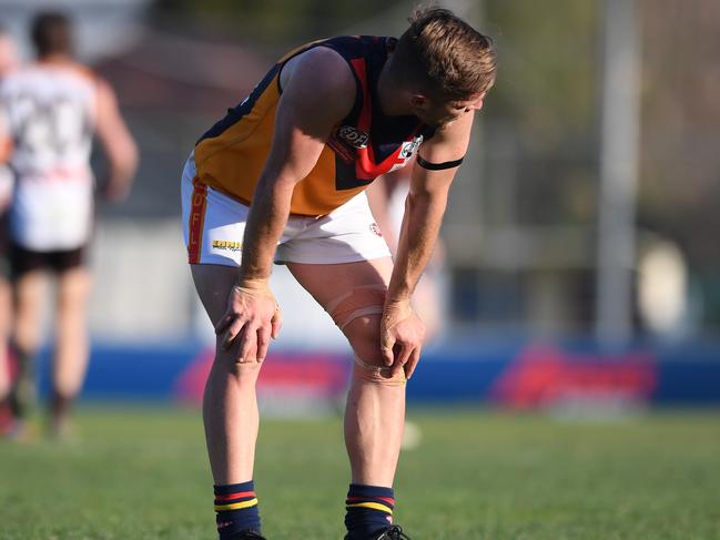 A shattered East Keilor player after Saturday’s loss. Picture: Andy Brownbill