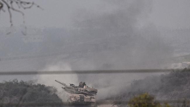 A picture taken from near the southern Israeli city of Sderot on October 28, shows an Israeli Merkava tank rolling close to the Israeli border with the northern Gaza Strip. Picture: AFP