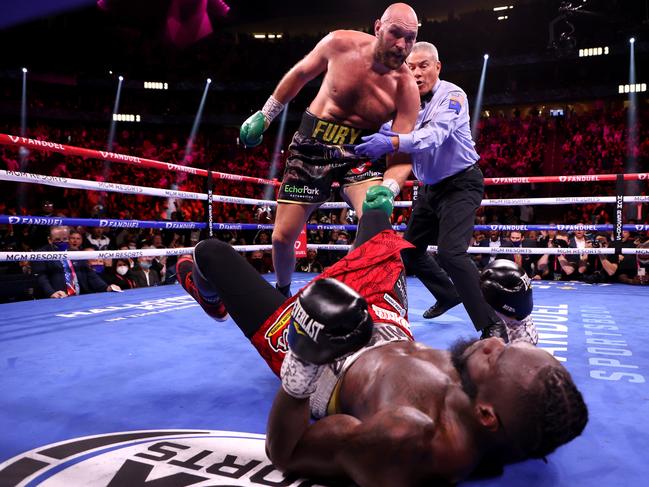 Tyson Fury stands over Deontay Wilder during their WBC heavyweight title fight at T-Mobile Arena on October 09, 2021 in Las Vegas. Picture: Al Bello/Getty Images