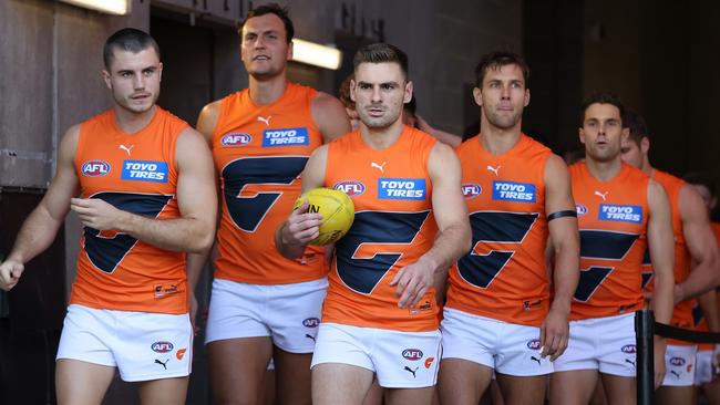 Stephen Coniglio leads the team out onto the field. Photo by Paul Kane/Getty Images.