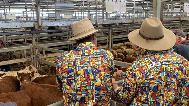 Agents donned Trademutt bright shirts to try to prompt conversations about mental health at the Wodonga store cattle sale.