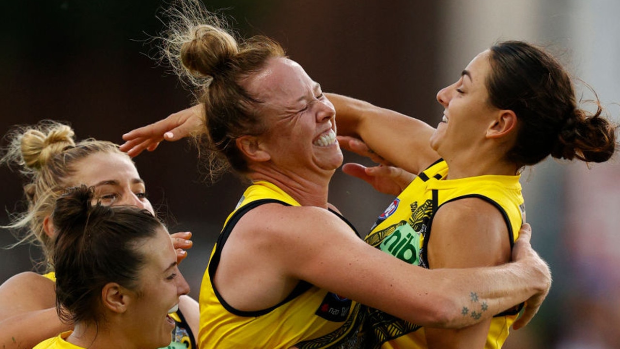 MELBOURNE, AUSTRALIA - JANUARY 07: Courtney Wakefield of Richmond celebrates a goal during the round one AFLW match between the St Kilda Saints and the Richmond Tigers at on January 07, 2022 in Melbourne, Australia. (Photo by Darrian Traynor/Getty Images)