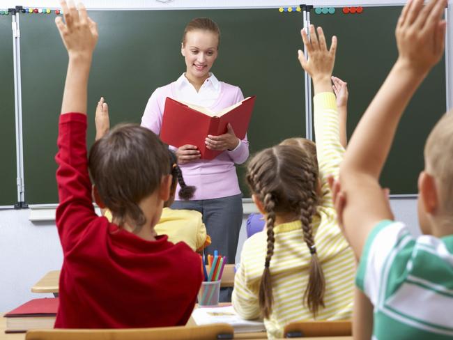 Generic image of teacher teaching students inside school classroom.