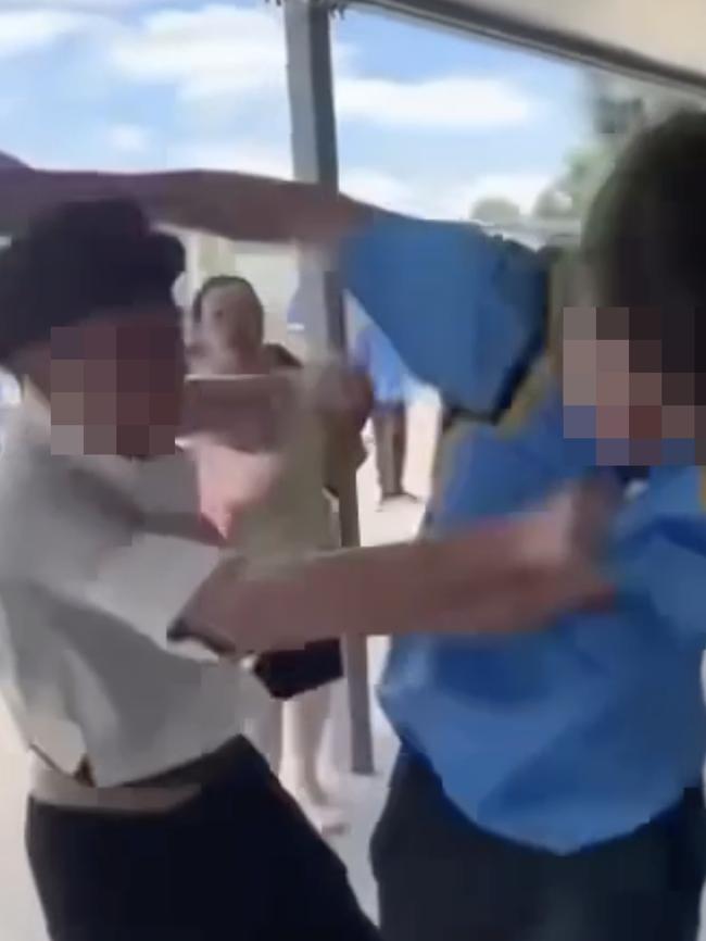 Two boys were captured brawling in front of dozens of students. Picture: Supplied