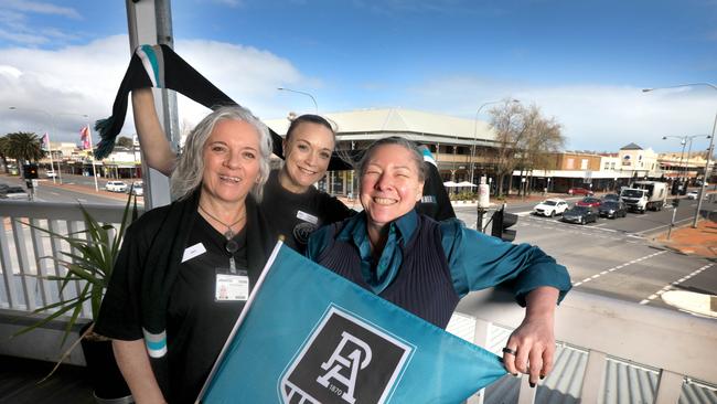 Port Admiral Hotel Staff keen to capitalise on the business benefits of Port making the finals. Simone Douglas (R) and staff members, Jenny O’Shea (L), and Kerrie Hazelhurst, getting into the Power spirit. Picture Dean Martin