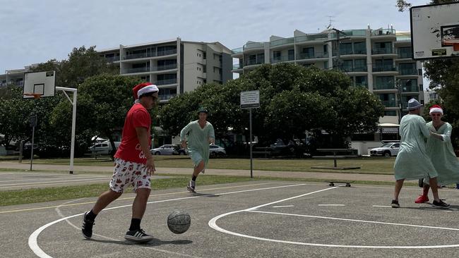 Ryan, Lucas, Arley, and Matt playing basketball. Photo: Asa Andersen.