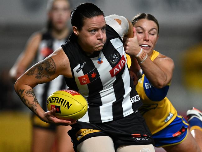 MELBOURNE, AUSTRALIA - SEPTEMBER 17: Brianna Davey of the Magpies is tackled during the round four AFLW match between Collingwood Magpies and West Coast Eagles at Ikon Park, on September 17, 2024, in Melbourne, Australia. (Photo by Quinn Rooney/Getty Images)