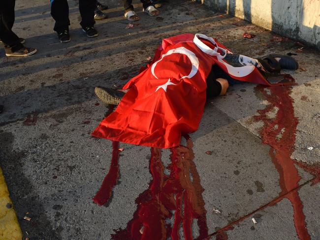 A civilian killed by Turkish soldiers lies on a ground on the Bosphorus bridge in Istanbul. Picture: Bulent Kilic