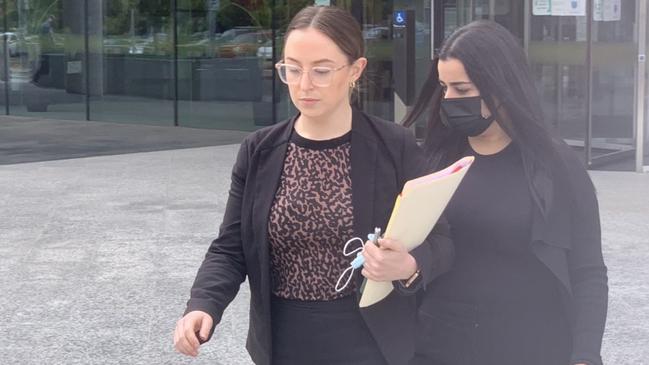 Petra Shasha (right) leaves the ACT Law Courts with her lawyer (left) on March 21 2022. Picture: Julia Kanapathippillai