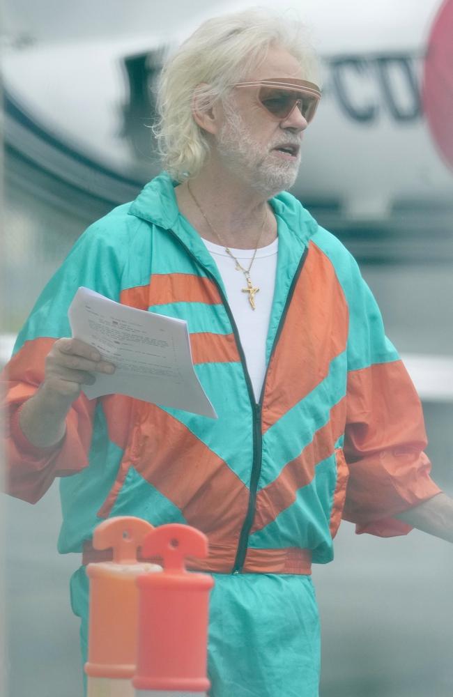 Sir Bob Geldof looks over his lines for his part in Zombie Plane movie being filmed at Gold Coast Airport. Picture: Backgrid/Splash