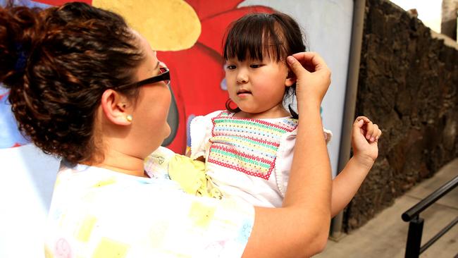 Annabelle Nguyen with one of the nurses at the Clinica 0-19 in Monterrey Mexico. Picture: Nathan Edwards