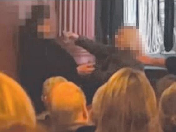 A still from a video showing a confrontation between a concert goer and protester at the Deborah Conway show at the Playhouse Theatre in Hobart. LEGALLED VERSION