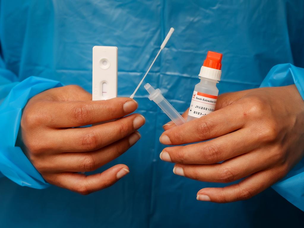 A nurse with a Rapid Antigen Test kit. There are calls for them to be free. Picture: Ian Currie