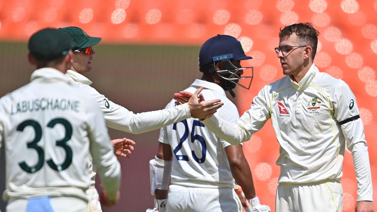 Todd Murphy celebrates after dismissing Cheteshwar Pujara. Picture: Punit Paranjpe / AFP