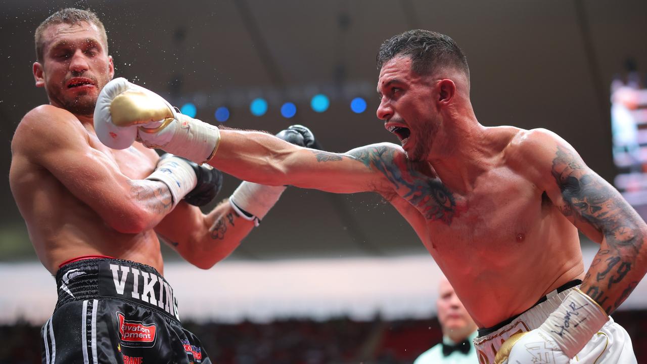 Gabriel Gollaz of Mexico punches Steve Spark of Australia. Photo by Hector Vivas/Getty Images