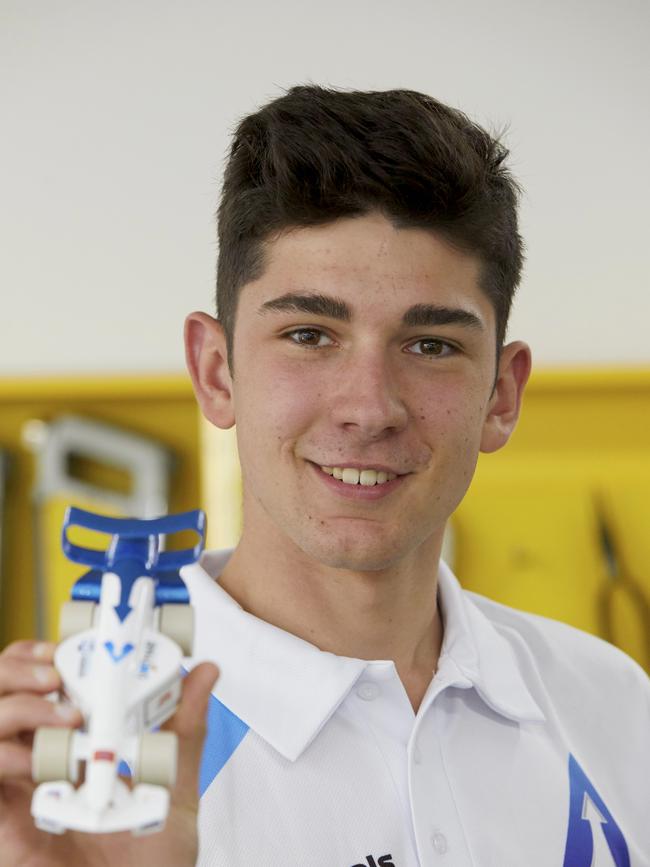 Penrith Christian School Year 10 student, Brock Stinson, poses with the winning car design. Picture: AAP Image/Angelo Velardo.