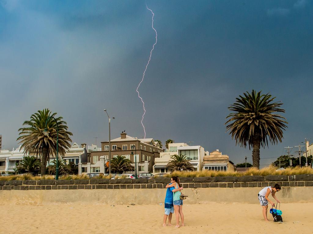 Finally, the end of the heatwave. The people on the beach didn’t see the lightning while they were hugging.