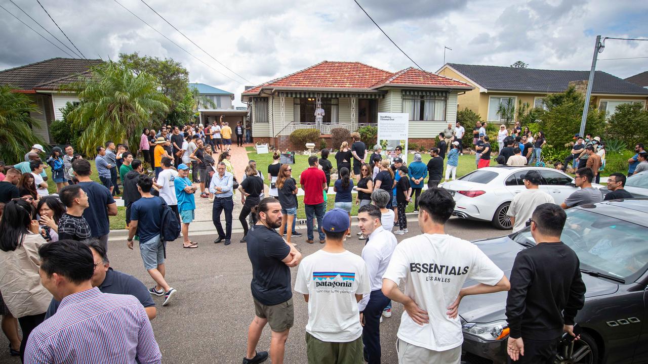 A crowd at a recent auction in Sydney, where stock levels have only recently begun to rise. Picture: Julian Andrews