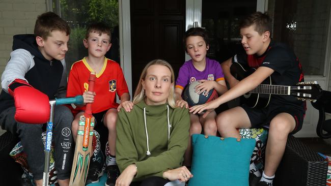 Kym Lange with her four sons [left to right] Cayden, 13, Brodie, 6, Jenson, 7, and Kobi, 11.  For the first time, the full impact of the coronavirus on our mental health has been uncovered. Nearly 60% of respondents to the YouGov poll report they are more stressed and 50% say they have a more negative view of the future - and interestingly, the younger generations remain the most optimistic while Baby Boomers have the most negative view of the future. One in four people report that the lockdown is also straining their personal relationships. Parents looking after kids seem to be doing it especially tough, with 60% saying the arrangements are increasing tensions in their households, and 44% saying home schooling is difficult. Picture: Alex Coppel.