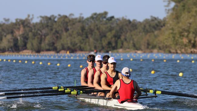 A Rockhampton Grammar School crew practices before a Queensland Secondary Schools Rowing Championships on the Fitzroy River course.