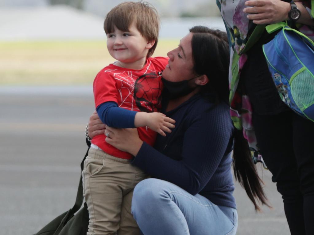 Memphis Francis is reunited with his mother Dominique Facer at Archerfield airport in Brisbane Picture: Lachie Millard