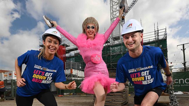 Construction industry workers Ava Curtis and Kieren Sturgiss with performer Lulu LeMans are preparing for the Bridge To Brisbane on September 8. Picture: Lyndon Mechielsen/Courier Mail