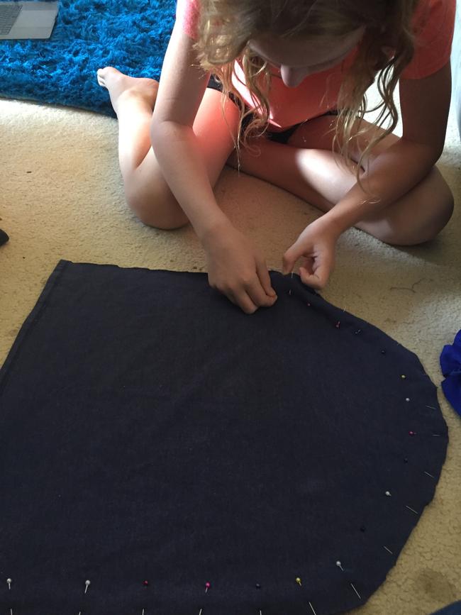 Molly has learnt to cut, pin and sew from scratch. Picture: Supplied