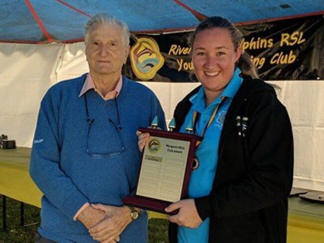 Riverstone Dolphins’s multiple medal winner and chief marshall Stephanie Kegg, who received the inaugural Margaret Mills Trophy from former councillor Ron Alder