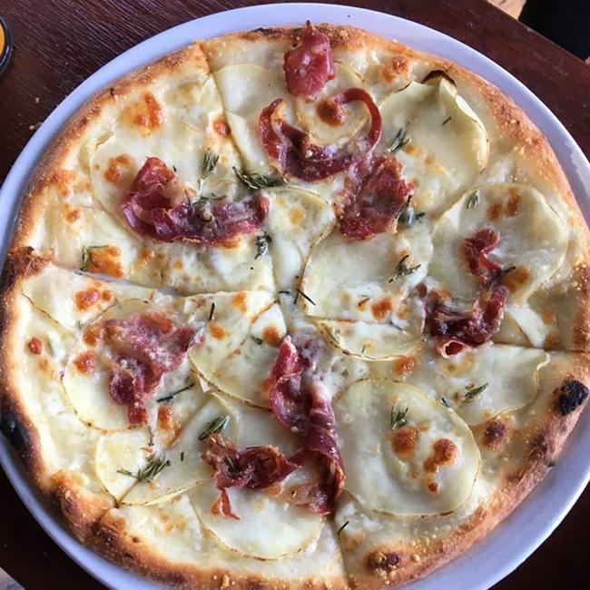 Potato pizza at Osteria Epoca is one of their most popular pizzas. Picture: Facebook/@osteriaepoca