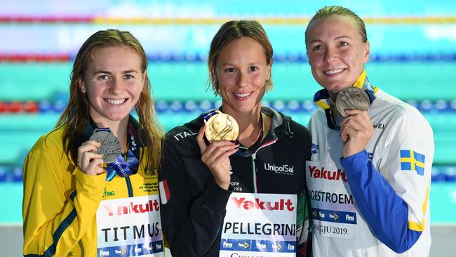 Silver medallist Australia's Ariarne Titmus (L), gold medallist Italy's Federica Pellegrini (C) and bronze medallist Sweden's Sarah Sjoestroem pose with their medals on the podium after the final of the women's 200m freestyle. Picture: Oli Scarff/AFP