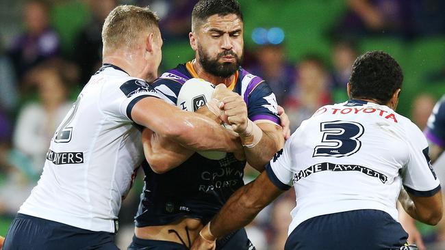 Jesse Bromwich charges into the Cowboys defence.