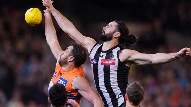 Shane Mumford gets front position in his ruck duel with Brodie Grundy. Picture: AAP