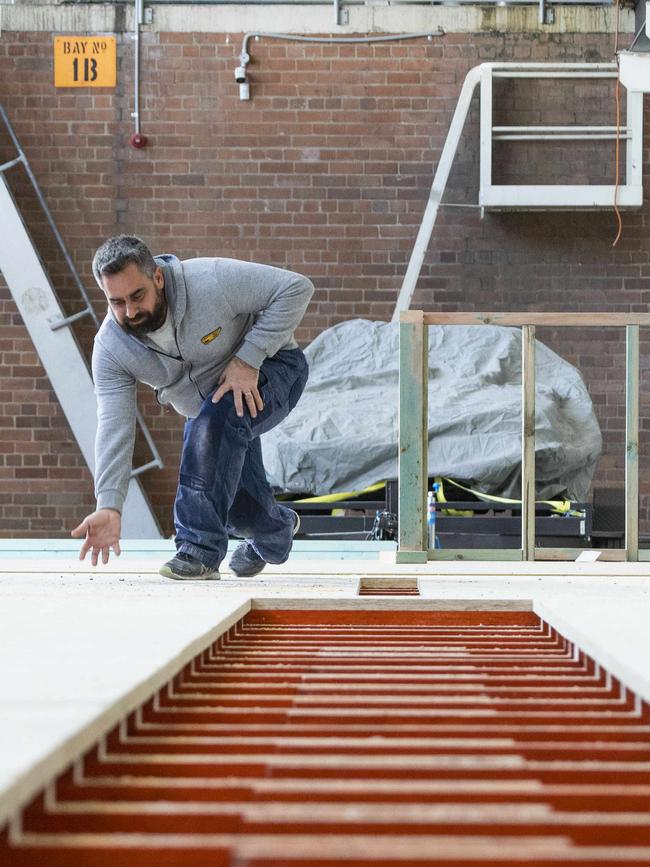 Owner John Papantoniou checks out the bowling alleys which are under construction. Picture: Matthew Vasilescu