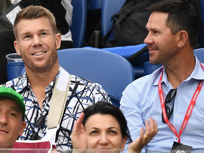 David Warner (left) and Ricky Ponting catch up at the Australian Open during Warner’s time on the sidelines. 