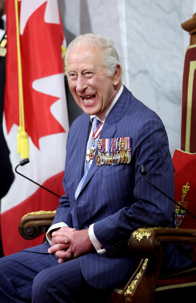 King Charles III smiles as he sits on the throne in the Senate Chamber. It is The King's 20th and Queen's 5th tour of Canada. Picture: Getty Images