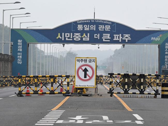 Barricades are seen at a military checkpoint on the Tongil bridge, the road leading to North Korea's Kaesong city, in the border city of Paju on October 15, 2024.