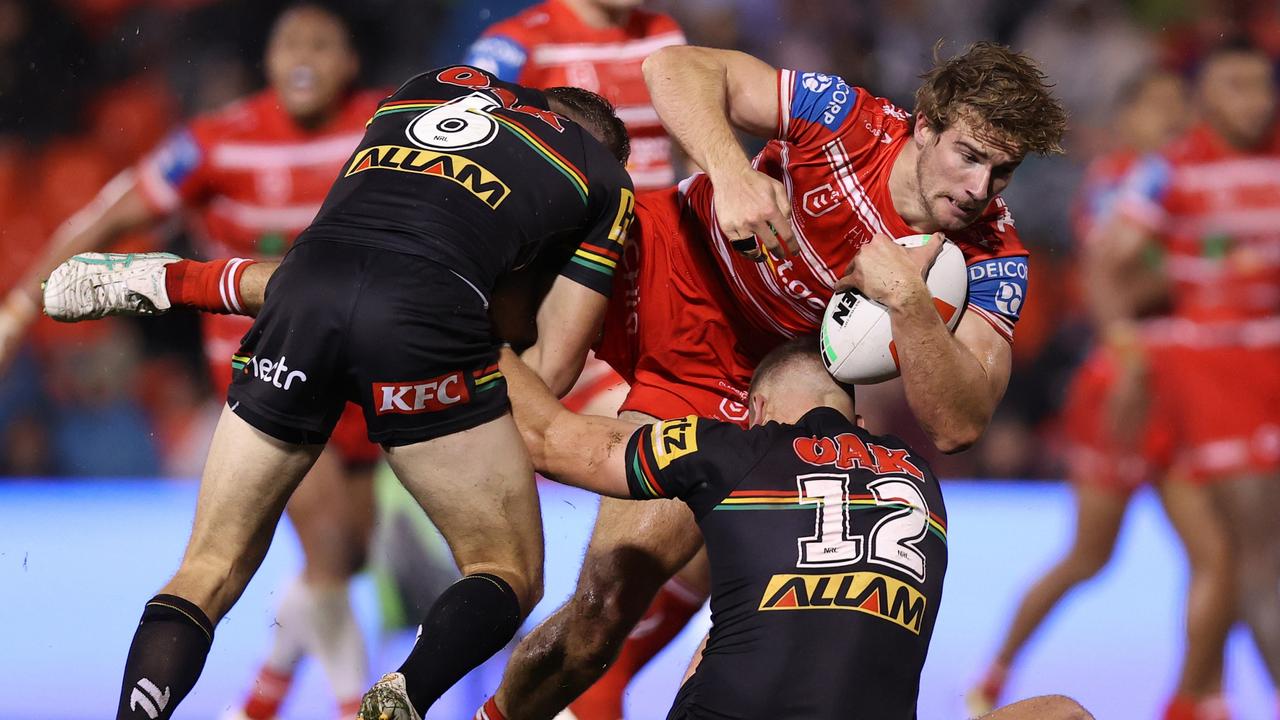 Toby Couchman of the Dragons is tackled during the round 13 NRL match between Penrith Panthers and St George Illawarra Dragons at BlueBet Stadium on June 01, 2024 in Penrith, Australia. (Photo by Jason McCawley/Getty Images)