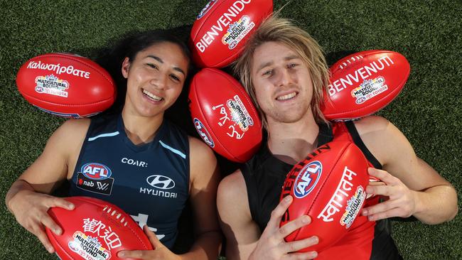 Multicultural Round ambassadors Dyson Heppell and Darcy Vescio check out the special balls. Picture: David Crosling